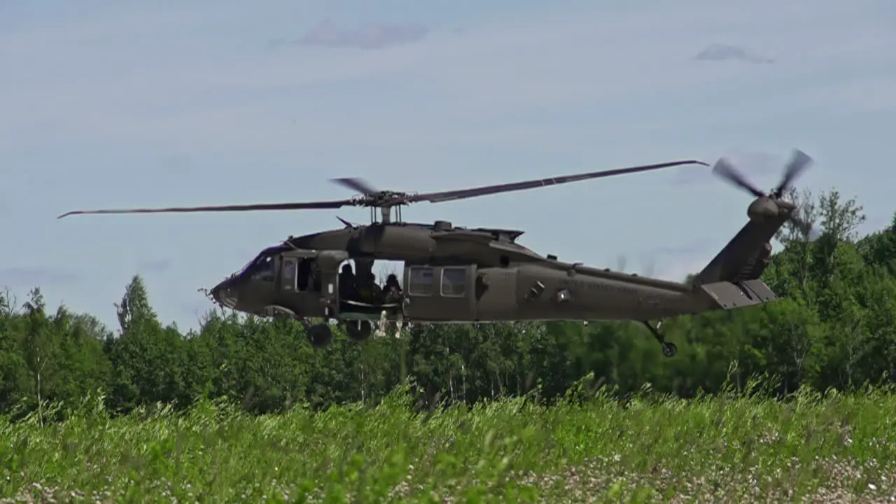 Blackhawk Military Helicopter Landing on a Forest in Slowmotion