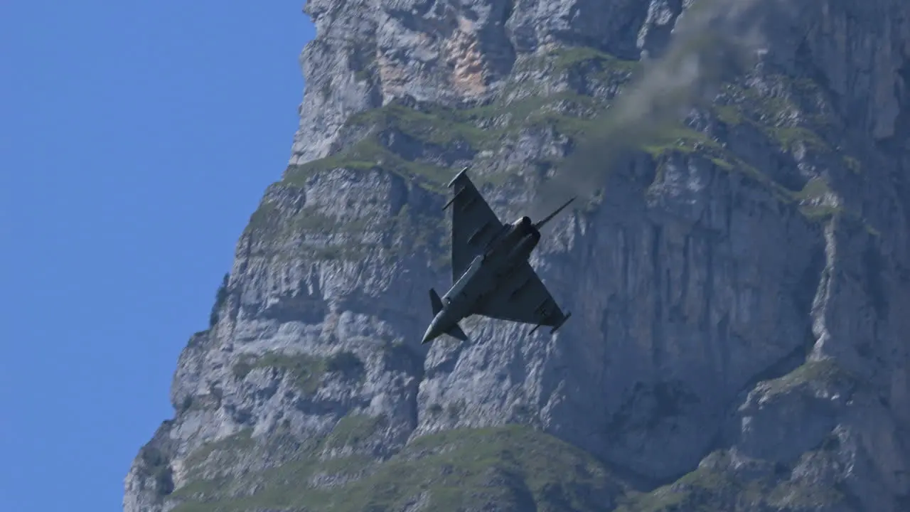 Eurofighter typhoon doing tricks in airshow in Switzerland view from bellow