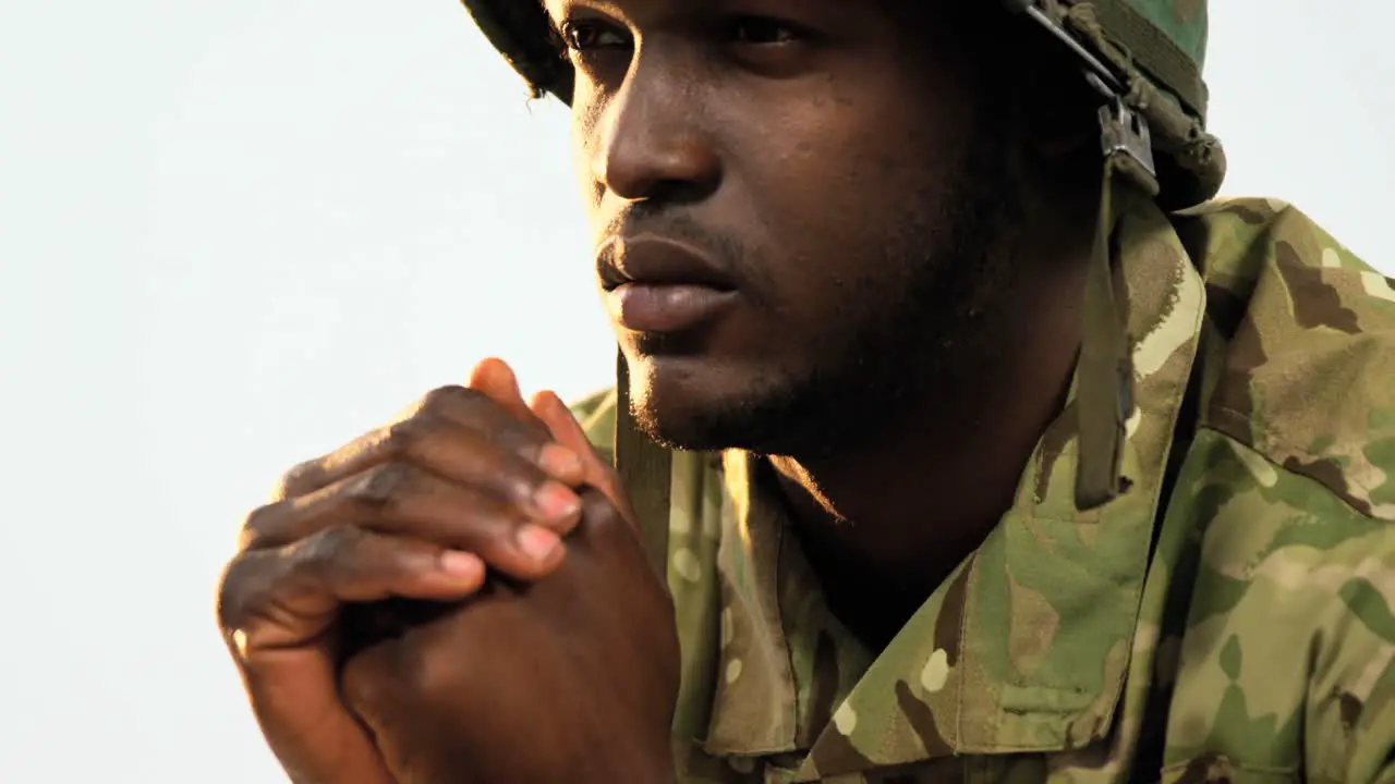 Thoughtful military soldier sitting