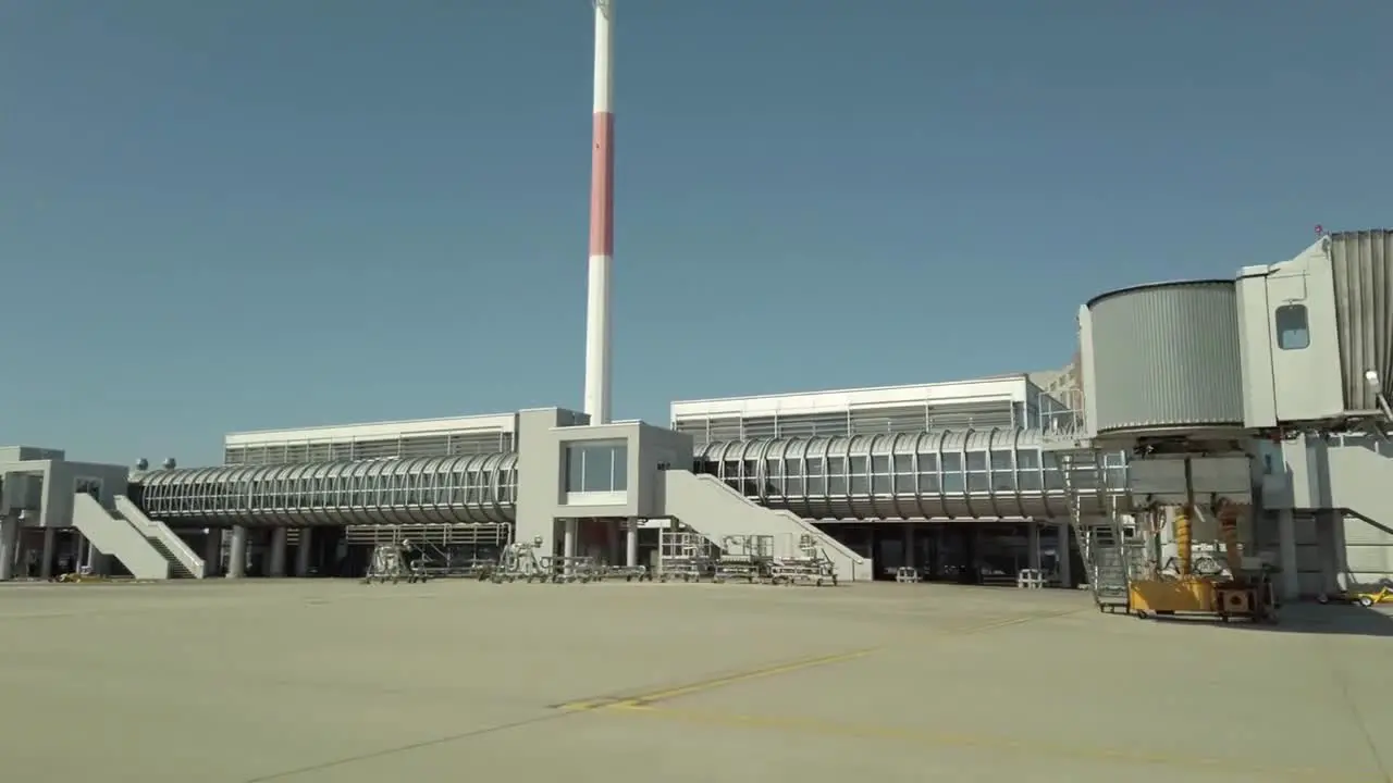 Drive By Footage Of The Tarmac Jet Bridges And Airport Terminal At Ramstein Afb