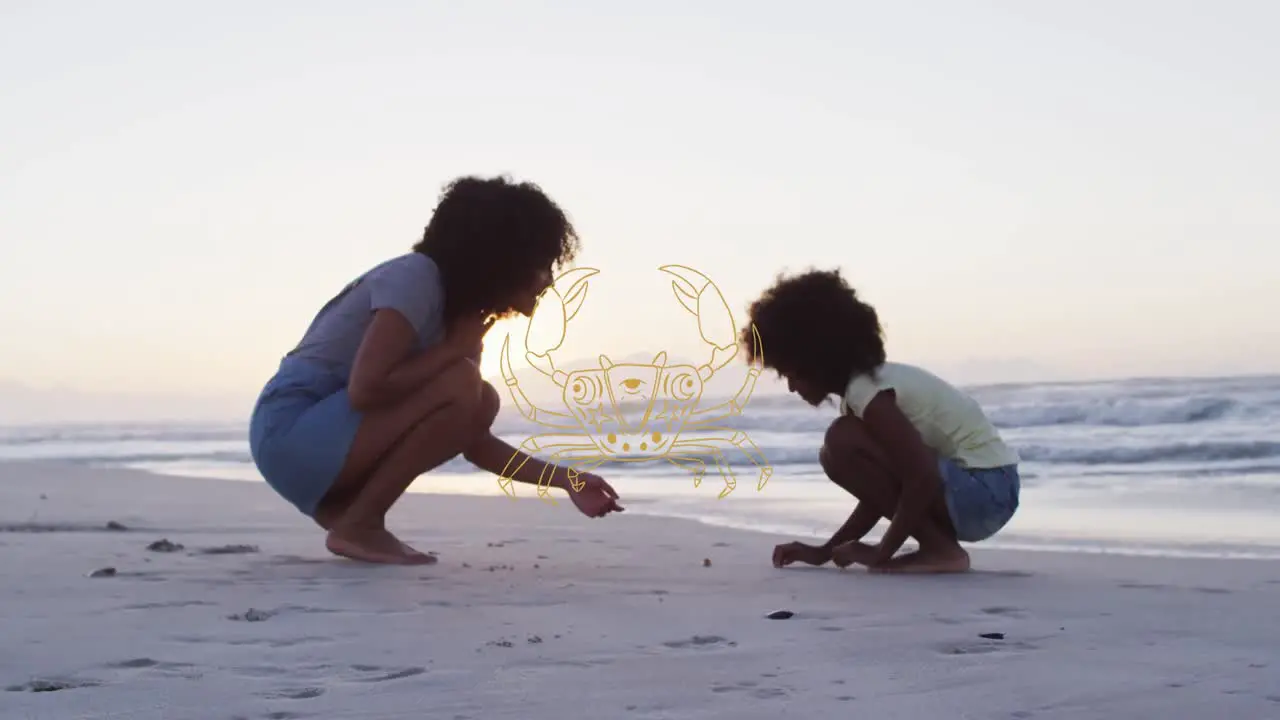 Animation of cancer over african american mother and son picking up shells on beach at sunset