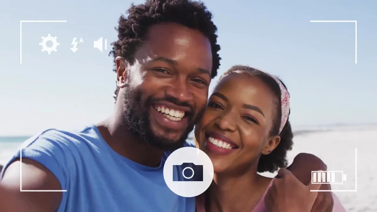 Animation of dots over happy african american taking selfie on beach