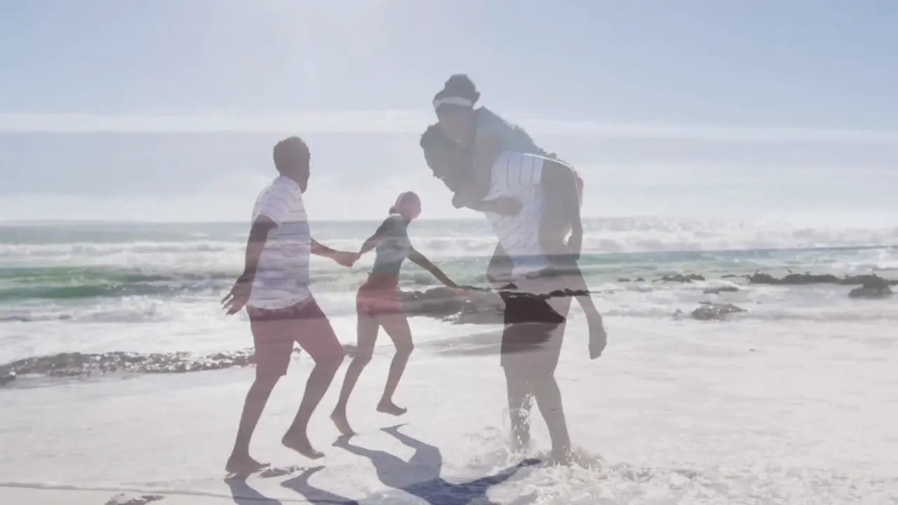 Animation of happy african american couple having fun on beach