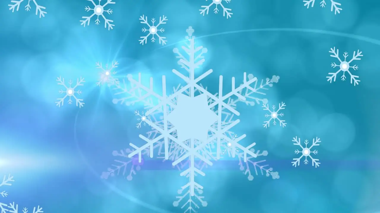 Animation of star over large snowflake lens flare and bokeh effect with moving snowflakes