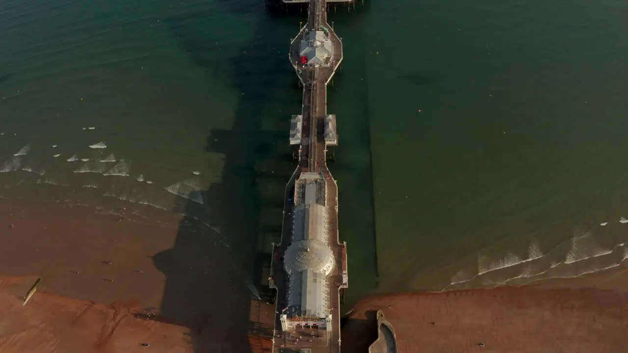 Aerial shot looking down over the length of Brighton Pier