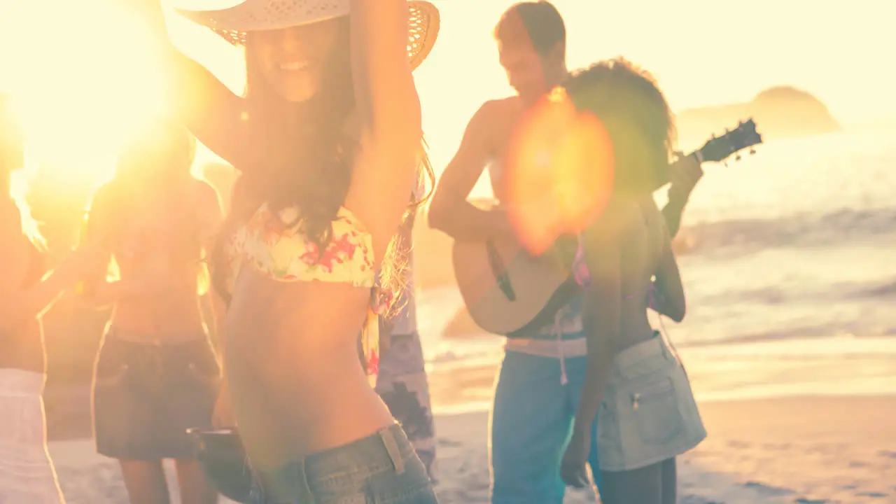 Diverse friends having party on beach