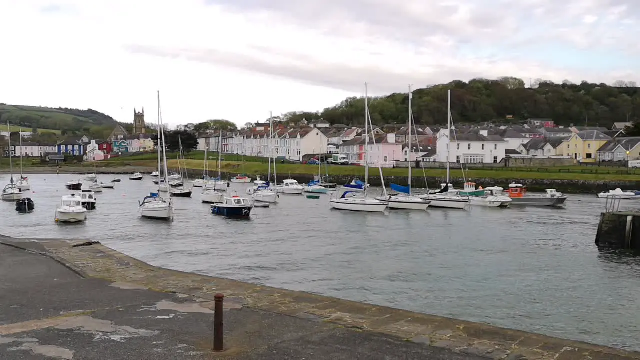 Boats in Aberaeron harbor West Wales slow pan