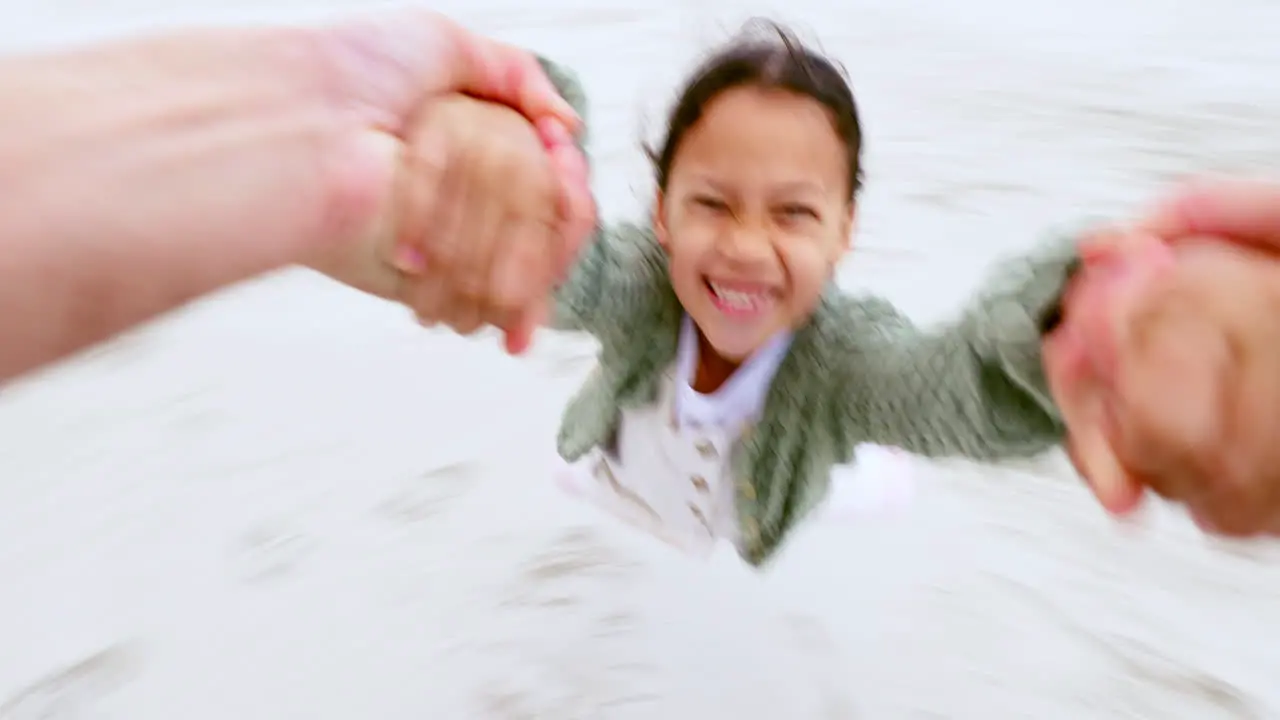 Child pov and swinging from hands at the beach