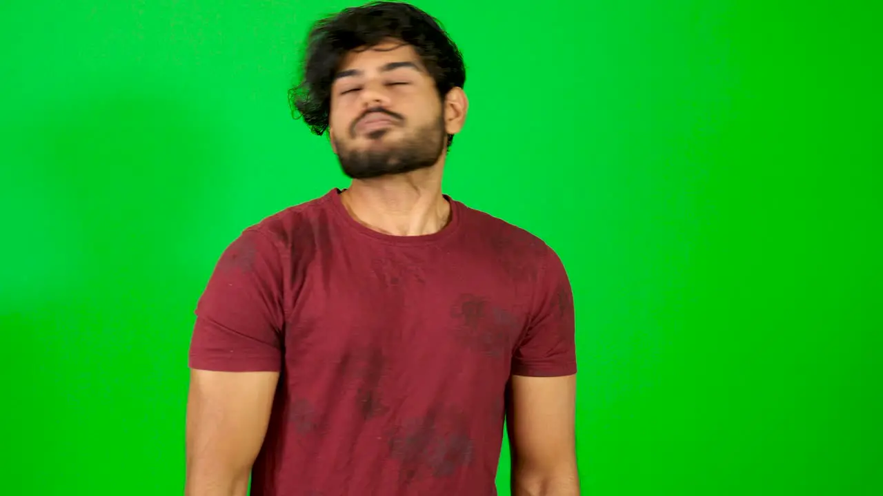 Indian man shy with green background Indian green screen