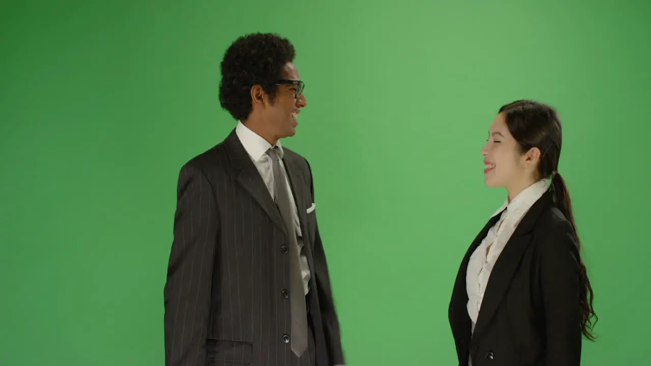 Man and Woman in Suits Hi Five in Slow Motion