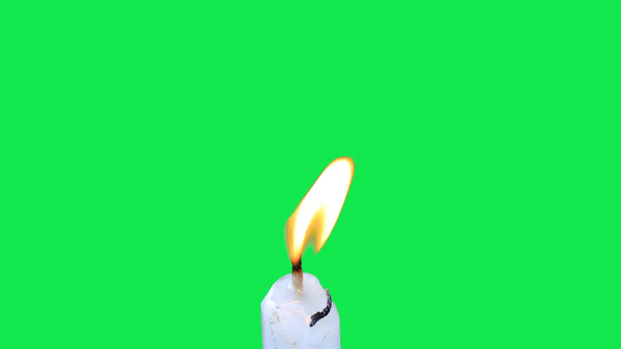 Burning Candle against green screen chroma key