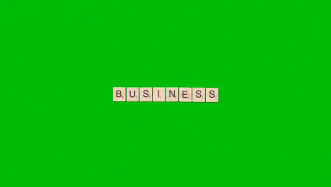 Stop Motion Business Concept Overhead Wooden Letter Tiles Forming Word Business On Green Screen