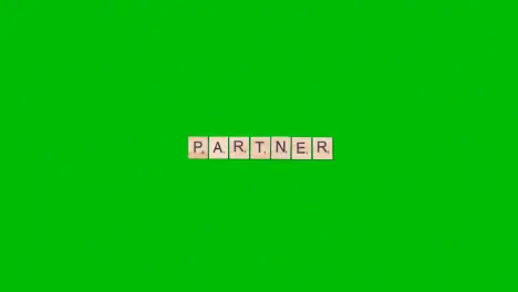 Stop Motion Business Concept Overhead Wooden Letter Tiles Forming Word Partner On Green Screen