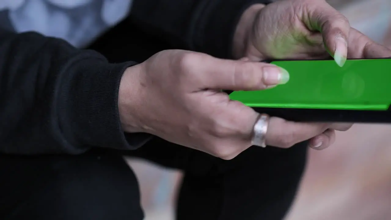 Female Asian Hands Holding Green Screen Smartphone Typing