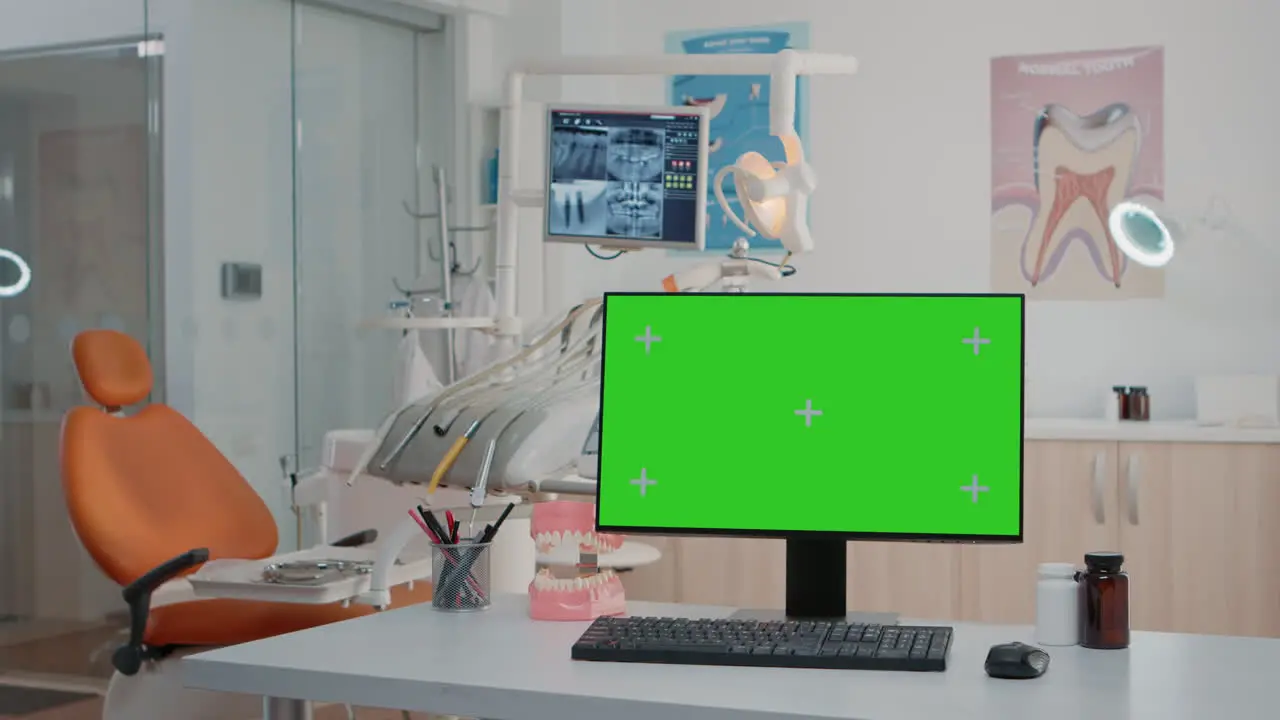 Nobody in stomatology office with green screen on computer