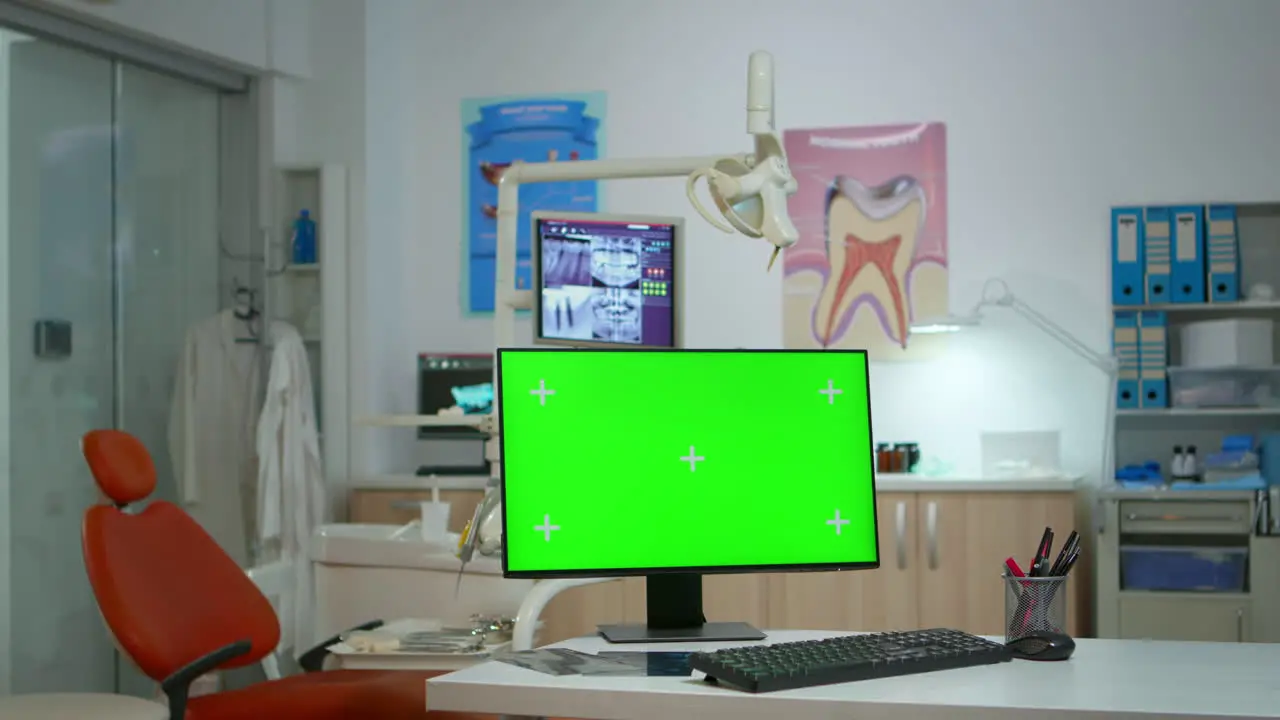 Computer with green screen in stomatological clinic