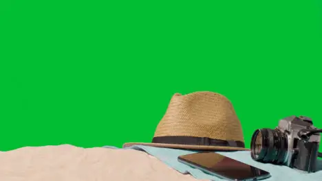 Summer Holiday Concept Of Camera Mobile Phone Sun Hat Beach Towel On Sand Against Green Screen 2