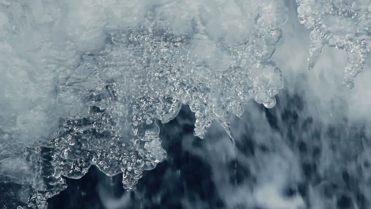 Ice and water in spring Ice melting Spring icicles with water drops Closeup