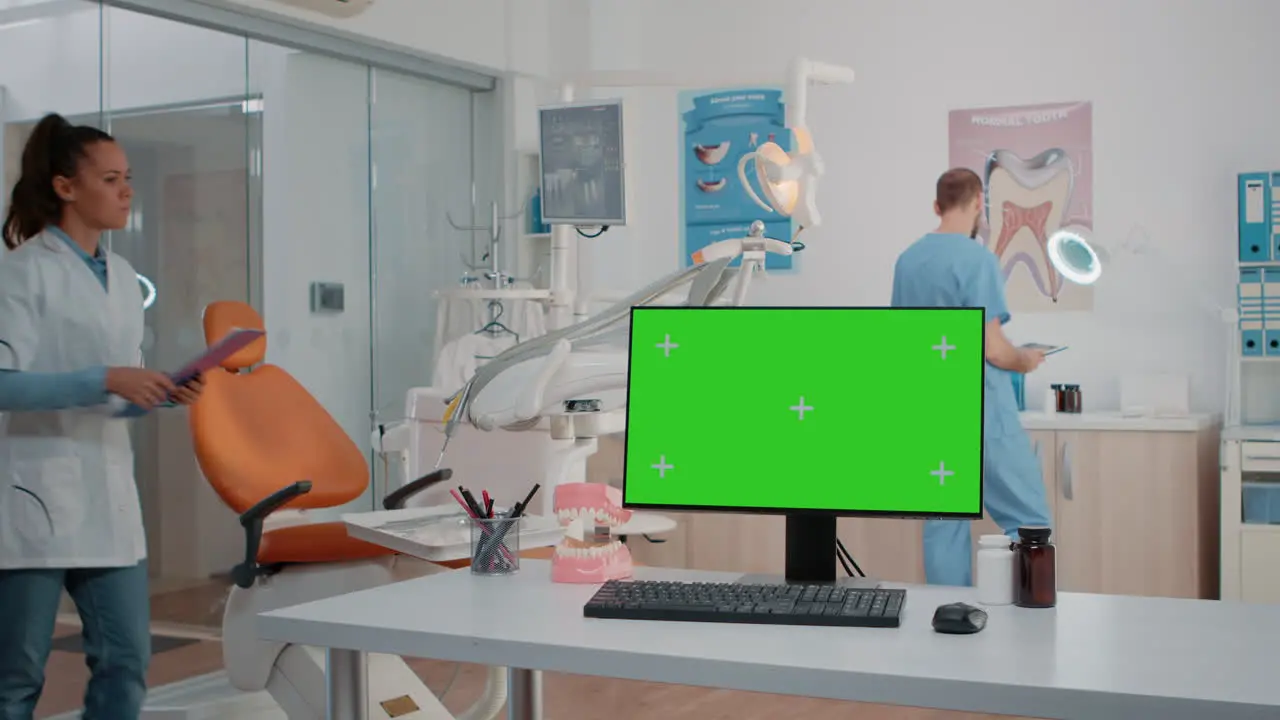 Dentist office with green screen on monitor and dental tools