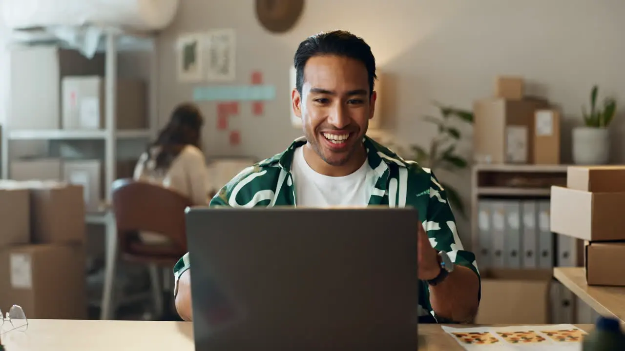 Happy asian man laptop and fist pump in winning