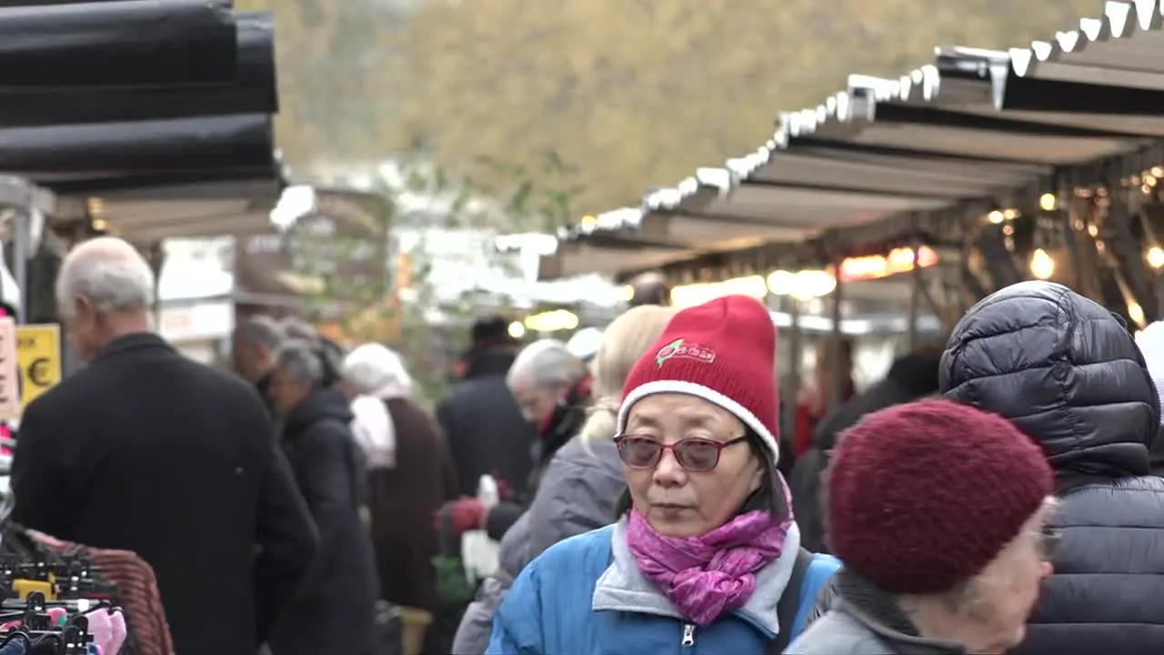 French people shop along an open market in the centre of Paris France 11-01-19