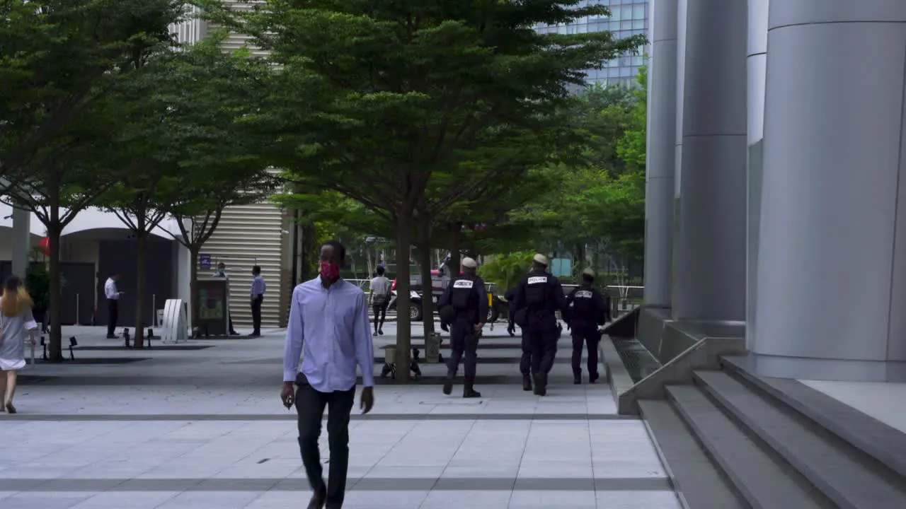 Group of policemen walking at Marina Bay Downtown Singapore