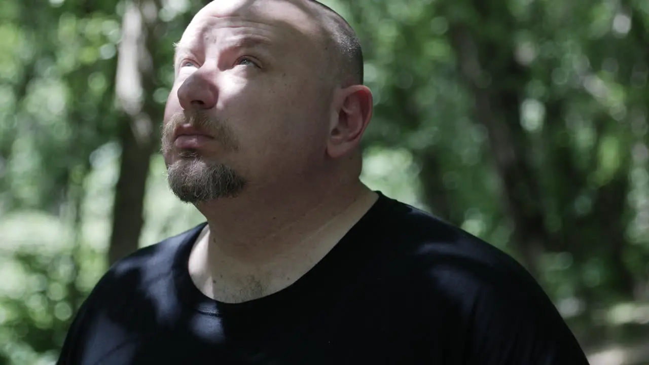 A man walking through forest trees