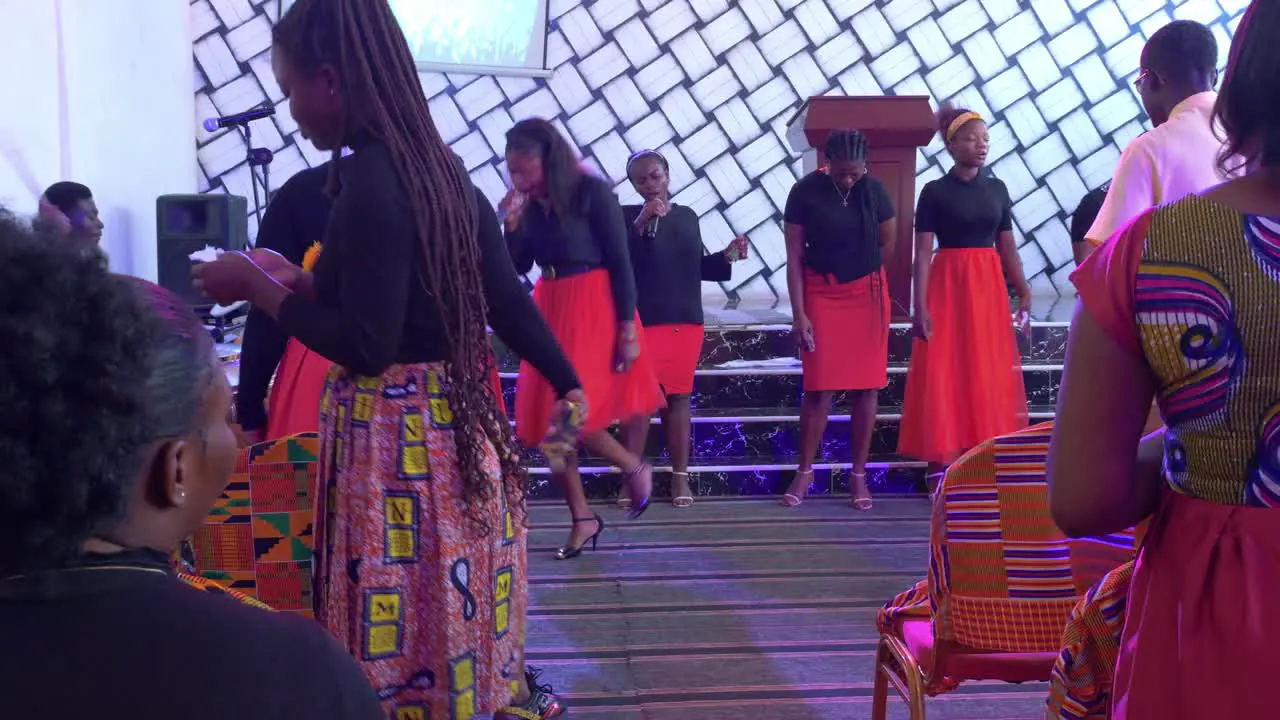 West african women dancing together in traditional wedding