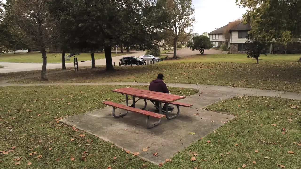 pan of a man on a bench