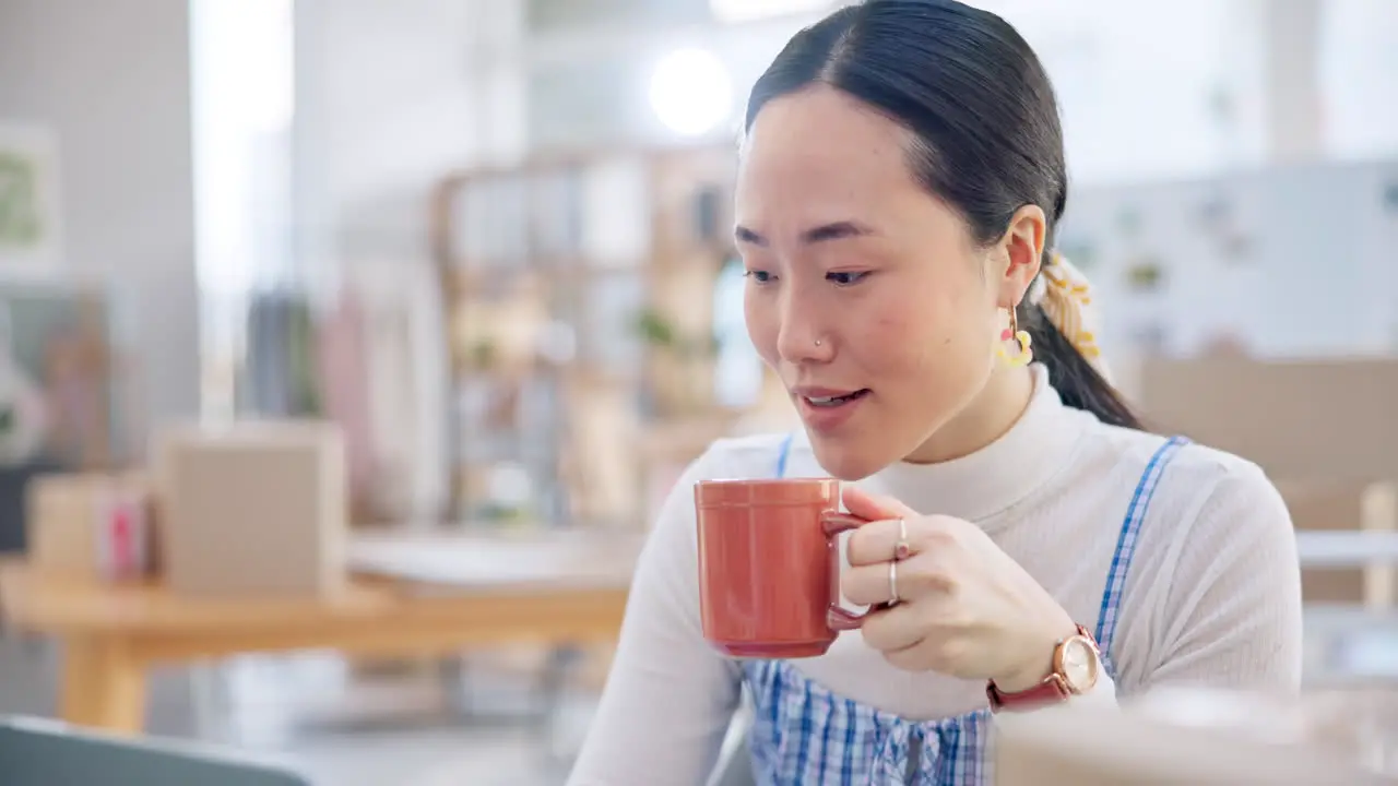 Ecommerce Asian woman at laptop with coffee