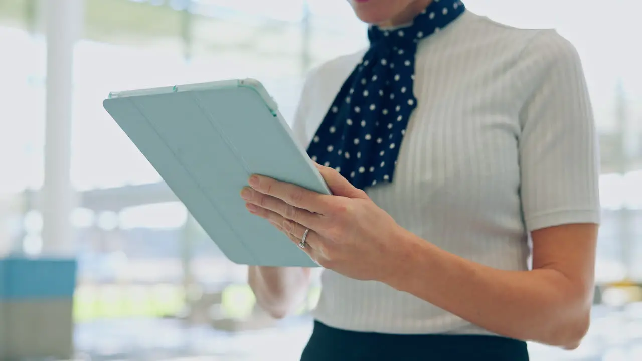 Tablet airport and hands of flight attendant