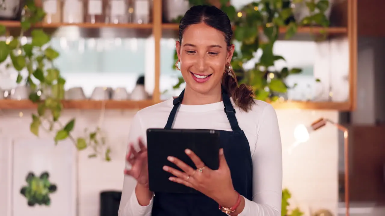 Cafe barista or happy woman on tablet