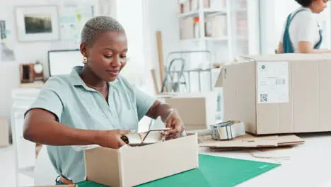 Startup shop and entrepreneur packing a box