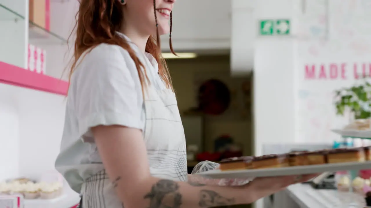 Cake waitress and bakery with woman in store