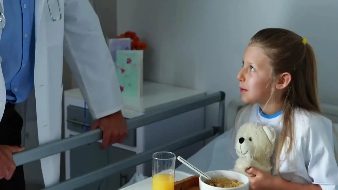 Doctor interacting with a sick girl