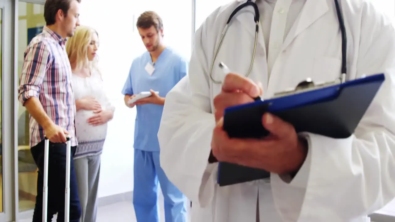 Portrait of male doctor holding a medical report