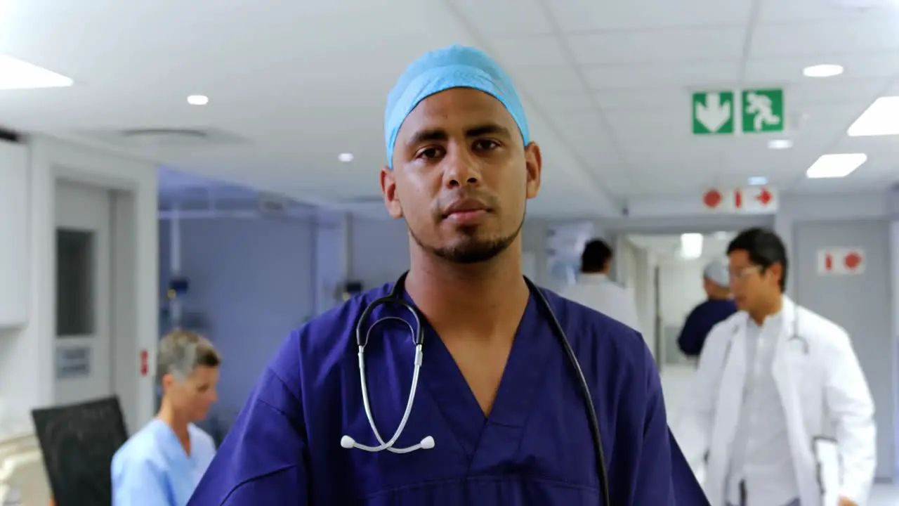 Male doctor writing on clipboard in the hospital 4k