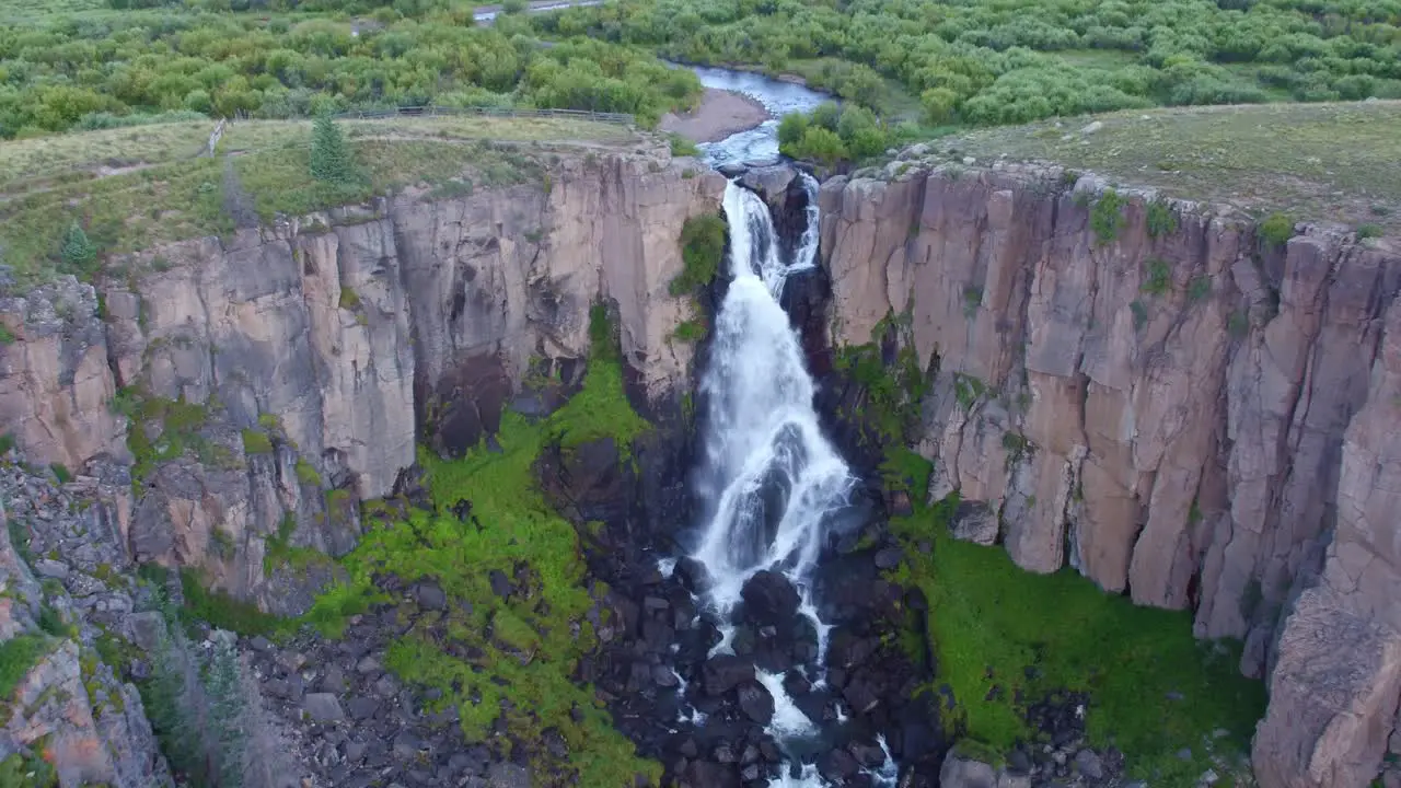 Drone view of a big waterfall on a creek