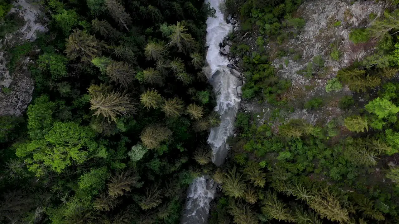 Aerial flyover with top down view of the Rhone river valley in Valais Switzerland