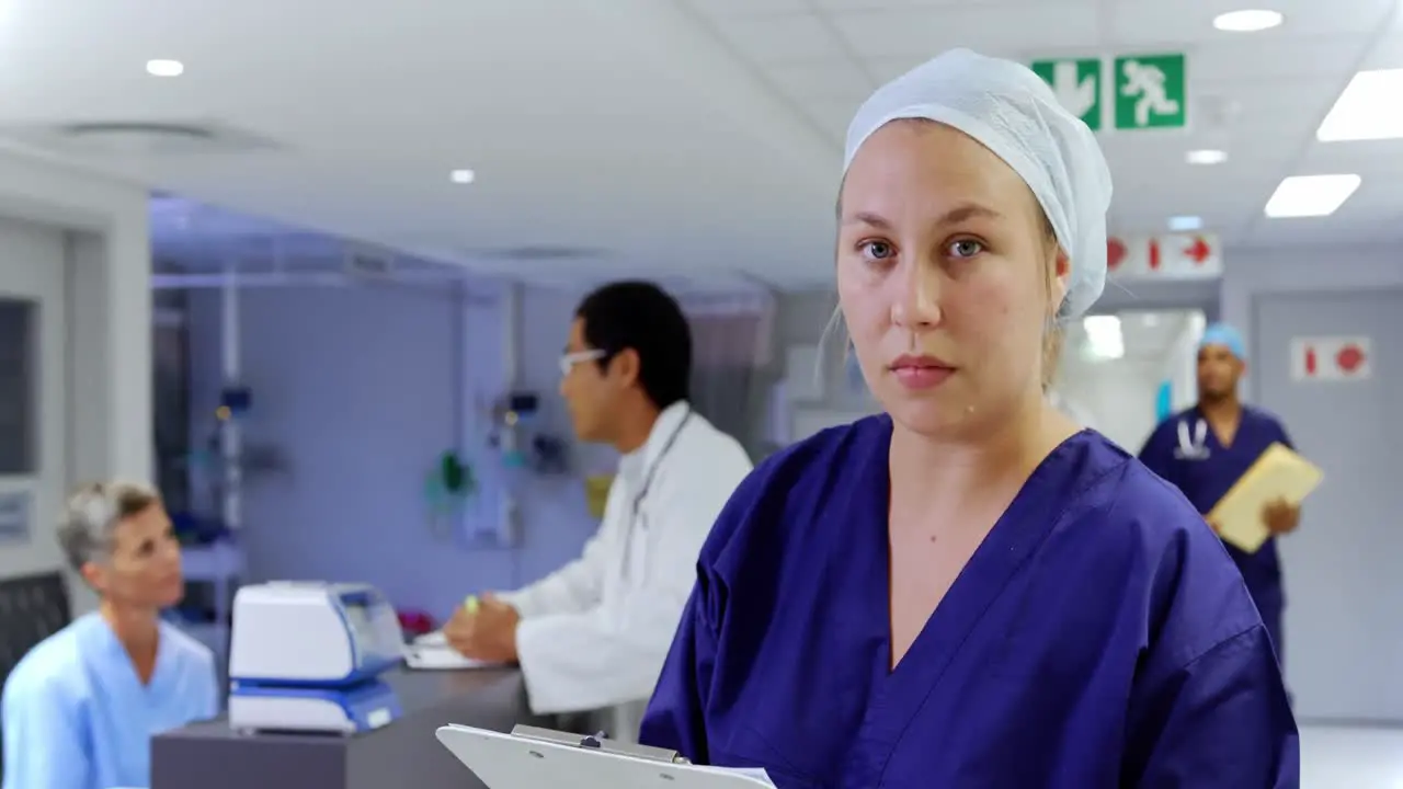 Female nurse writing on clipboard in the hospital 4k