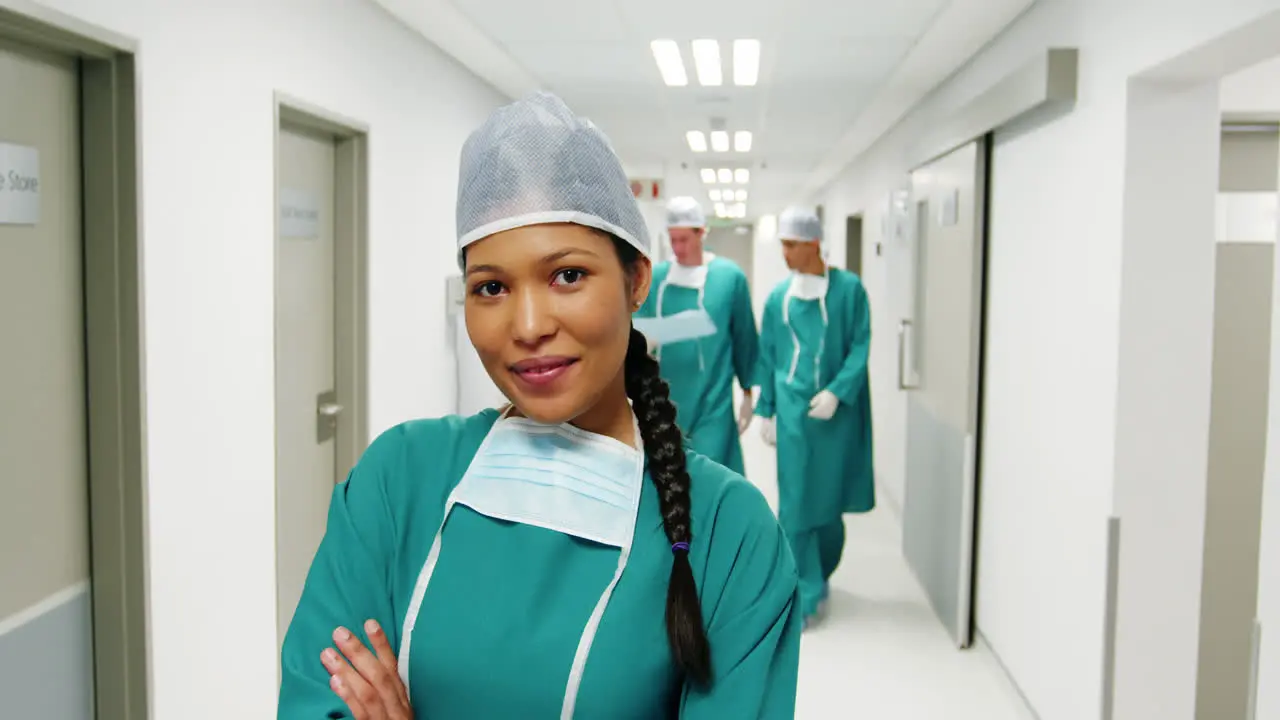 Portrait of nurse standing with arms crossed