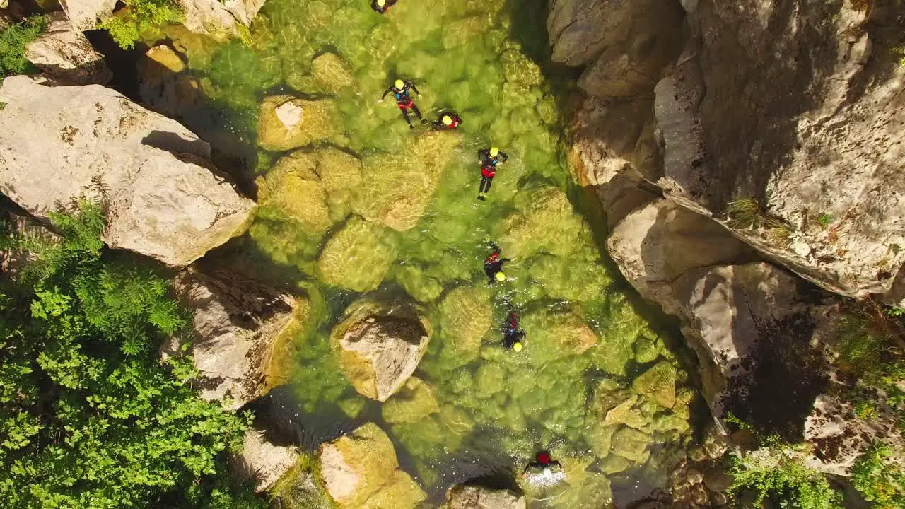 People in river green nature and rocks