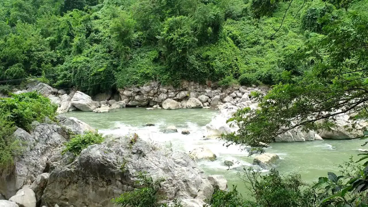 Stream flowing water with rocky terrain in a public park