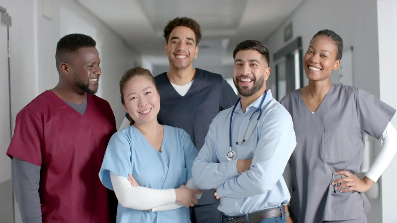 Diverse medical team smiling in a hospital corridor