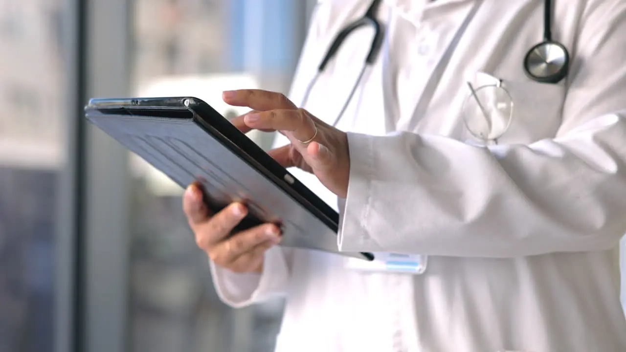 Closeup hands and doctor with tablet