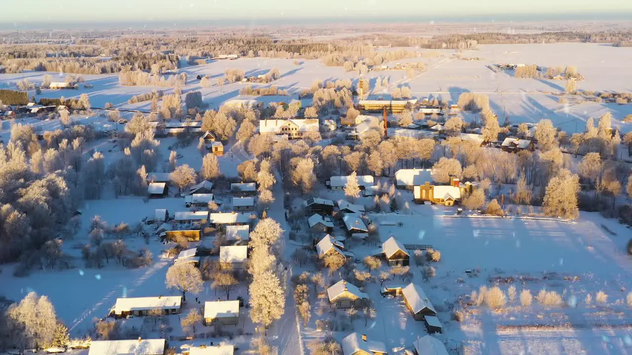 Iconic countryside township covered in snow in sunny winter day aerial view