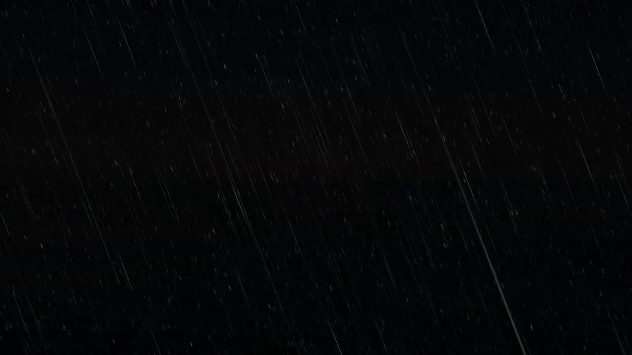 Animated simulation of pouring rain on black background