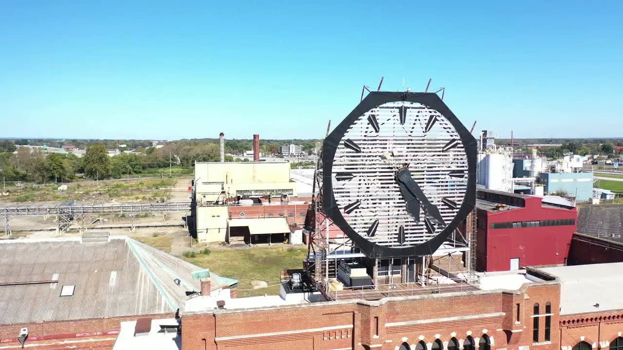 Aerial Of A Large Old Clock On The Facade Of An Old Abandoned Vacant American Factory Near Jeffersonville Indiana