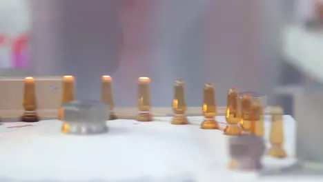 Sterile ampoules sealed with fire Ampoules on production line of pharmacy plant