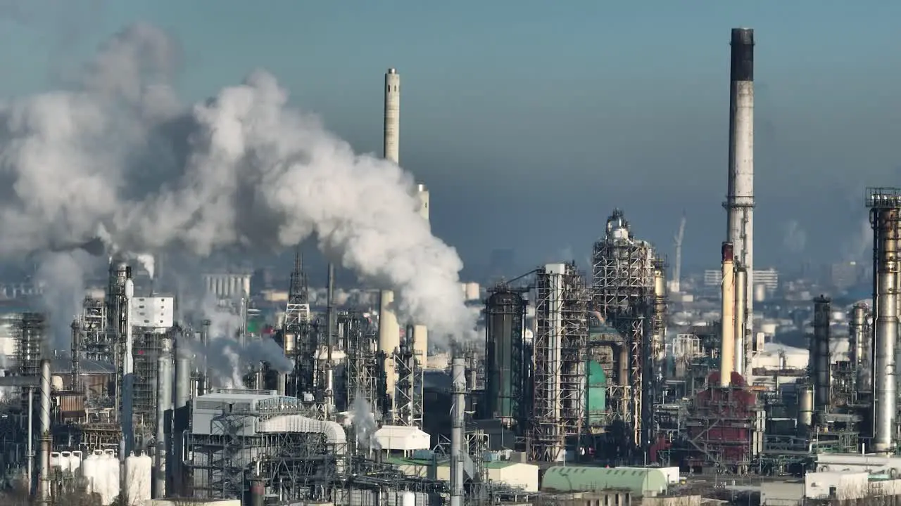 Factories and chimneys emitting greenhouse gases at Port of Rotterdam aerial